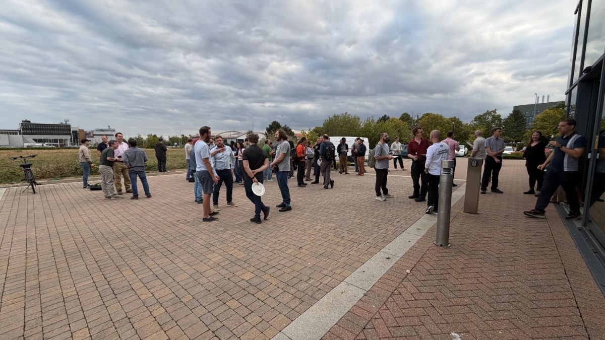 DevTechTalks attendees networking outside Tripadvisor’s Oxford office during the event.