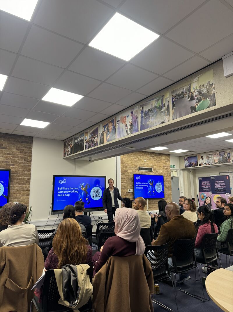 People sat in a room watching a talk